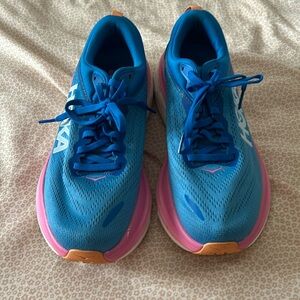 Selling new Hoka Bondi 8 tennis shoes. They are blue and pink. Size 8.5.
